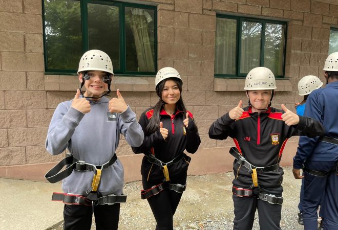 Year 10 students with their thumbs up in outdoor activity gear